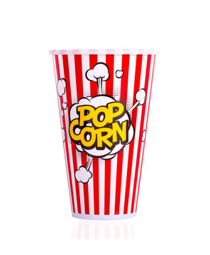 Popcorn in red bucket on white background