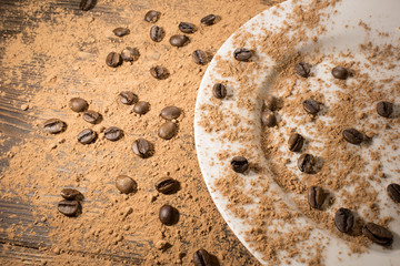 coffee beans scattered on the wooden table