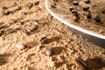 coffee beans scattered on the wooden table