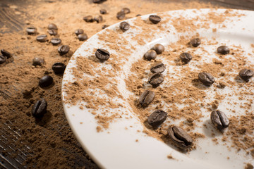 coffee beans scattered on the wooden table