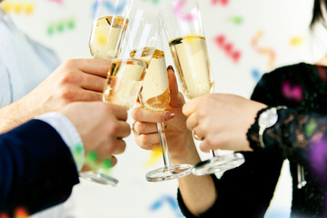 Celebration. Hands holding the glasses of champagne and wine making a toast. The party, celebration, alcohol, lifestyle, friendship, holiday, christmas, new, year and clinking concept