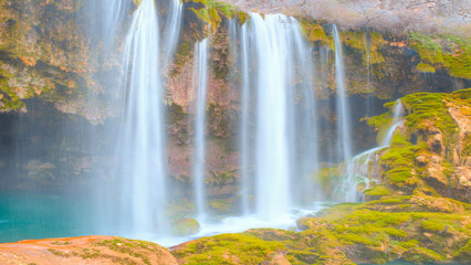 Amazing view of natural Yerkopru waterfall with crystal clear water among green mosses - Mersin, Turkey