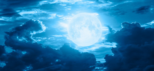 Night sky with moon in the clouds "Elements of this image furnished by NASA