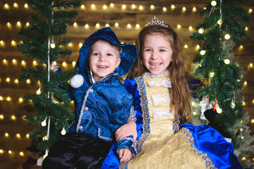 laughing kids in blue festive suits