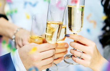 Celebration. Hands holding the glasses of champagne and wine making a toast. The party, alcohol, lifestyle, friendship, holiday, christmas, new, year and clinking concept