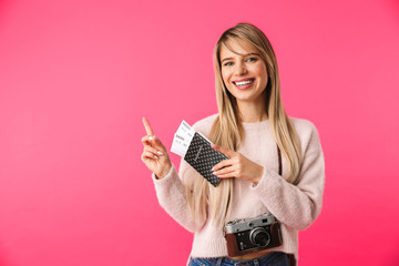 Cheerful young blonde woman wearing sweater