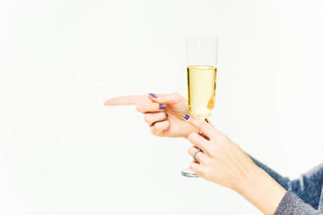 Celebration. The female hands holding the glasse of champagne or wine making a toast. The party, alcohol, lifestyle, friendship, holiday, christmas, new, year and clinking concept