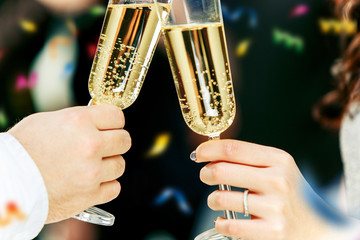 Celebration. Hands holding the glasses of champagne and wine making a toast. The party, alcohol, lifestyle, friendship, holiday, christmas, new, year and clinking concept
