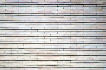 Perfect brick wall texture. Lights and shadows very equlibrate. A brick wall with very regular geometries. The porosity of the bricks and their alignment is sublimated by the diffused light.