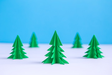 Christmas trees made of paper minimal creative winter concept. Space for copy.