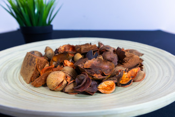 Potpourri Close-up view in the wooden plate with dark background