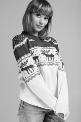 Beautiful blond woman with short hair in christmas sweater