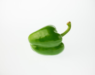 green pepper on white background.