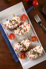 italian traditional food with bread and cheese on it
