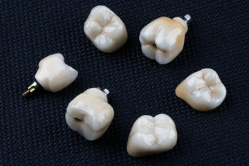 Dental ceramic crowns on a black background
