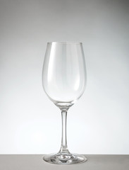 Empty wine glass on gray white background