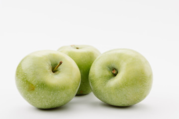 delicious large green apples on white background
