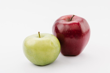 large ripe red and green apples on white background