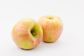 ripe golden delicious apples on white background
