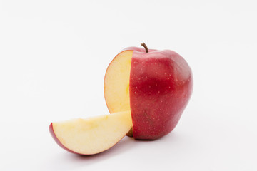 cut large red delicious apple on white background