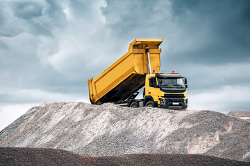 yellow truck with raised body