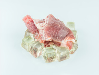 Raw meat on ice and white background,