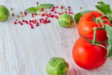 Fresh red vegetable on the wooden table. composition of vegetables, tomato, broccoli. Retro style. vertical view. healthy lifestyle.