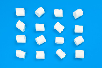 Marshmallows on blue background