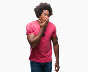 Afro american man over isolated background bored yawning tired covering mouth with hand. Restless and sleepiness.