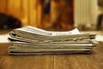 Stack of newspapers. Old journals and magazines with news. Yellow pages with headlines and articles...