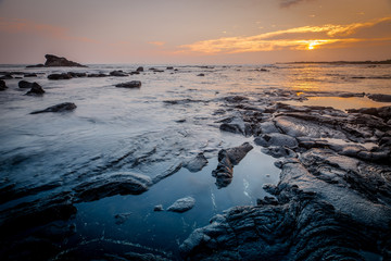 Lava Stone in the Pacific Ocean at Sunset