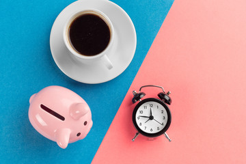 Obraz na płótnie Canvas Alarm clock and piggy bank concept for saving time