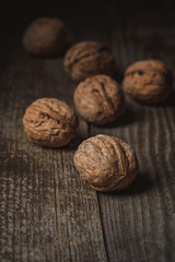 close up view of walnuts on wooden backdrop