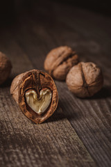 close up view of natural walnuts on wooden tabletop