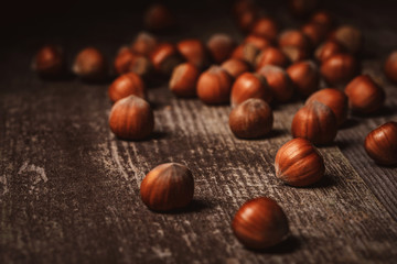 close up view of shelled hazelnuts on wooden tabletop
