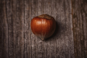 top view of shelled hazelnut on wooden surface