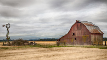 old red barn in the field