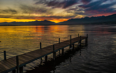 Stunning sunset on the shores of the Upper Zurich Lake near Rapperswil, Switzerland