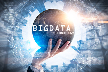 The double exposure image of the businessman hold the big data hologram on hand and element of this image furnished by Nasa. The concept of big data, hardware, futuristic, information and technology.