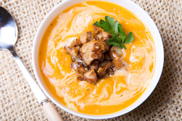 Pumpkin soup with porcini mushrooms. Selective focus, close-up.