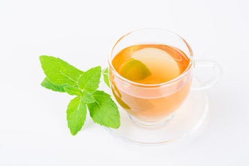 Mint tea. Cup of tea with fresh mint leaves on a white background.