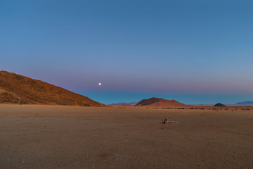Moon rise at sunset