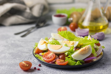 Egg tomato corn salad with mustard olive oil dressing. Selective focus, space for text.