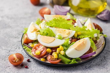 Egg tomato corn salad with mustard olive oil dressing. Selective focus, space for text.