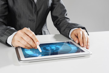 Internet security concept with woman working on media screen with stylus