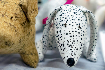 Soft toys of a dog and a piglet in a children's shop.