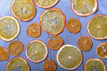 Dried orange slices on gray wooden background