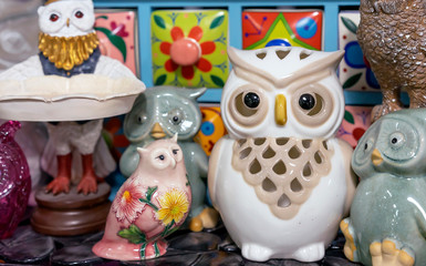 Different figurines of owls in the gift shop.