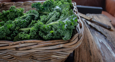 Kale on wooden  background  on daylight superfood vegetables