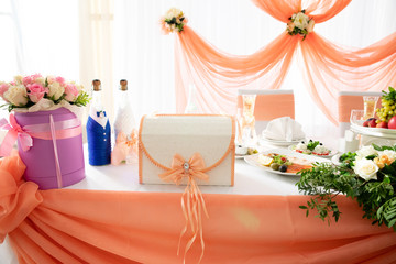 Served wedding table in the restaurant with box for money